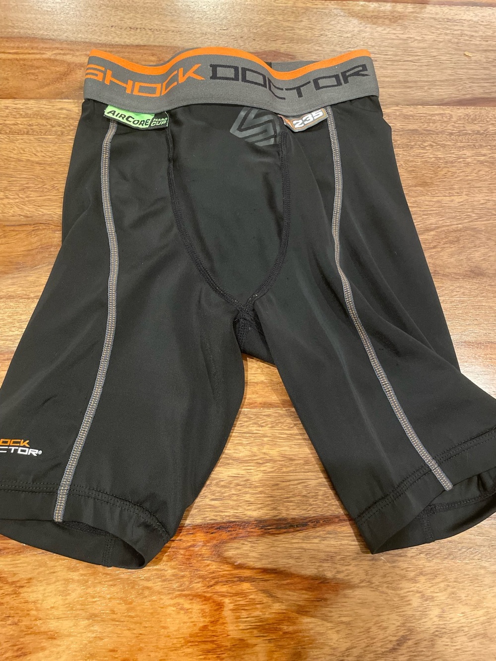 Shock Doctor Kid’s Black Compression Shorts with Orange Waistband